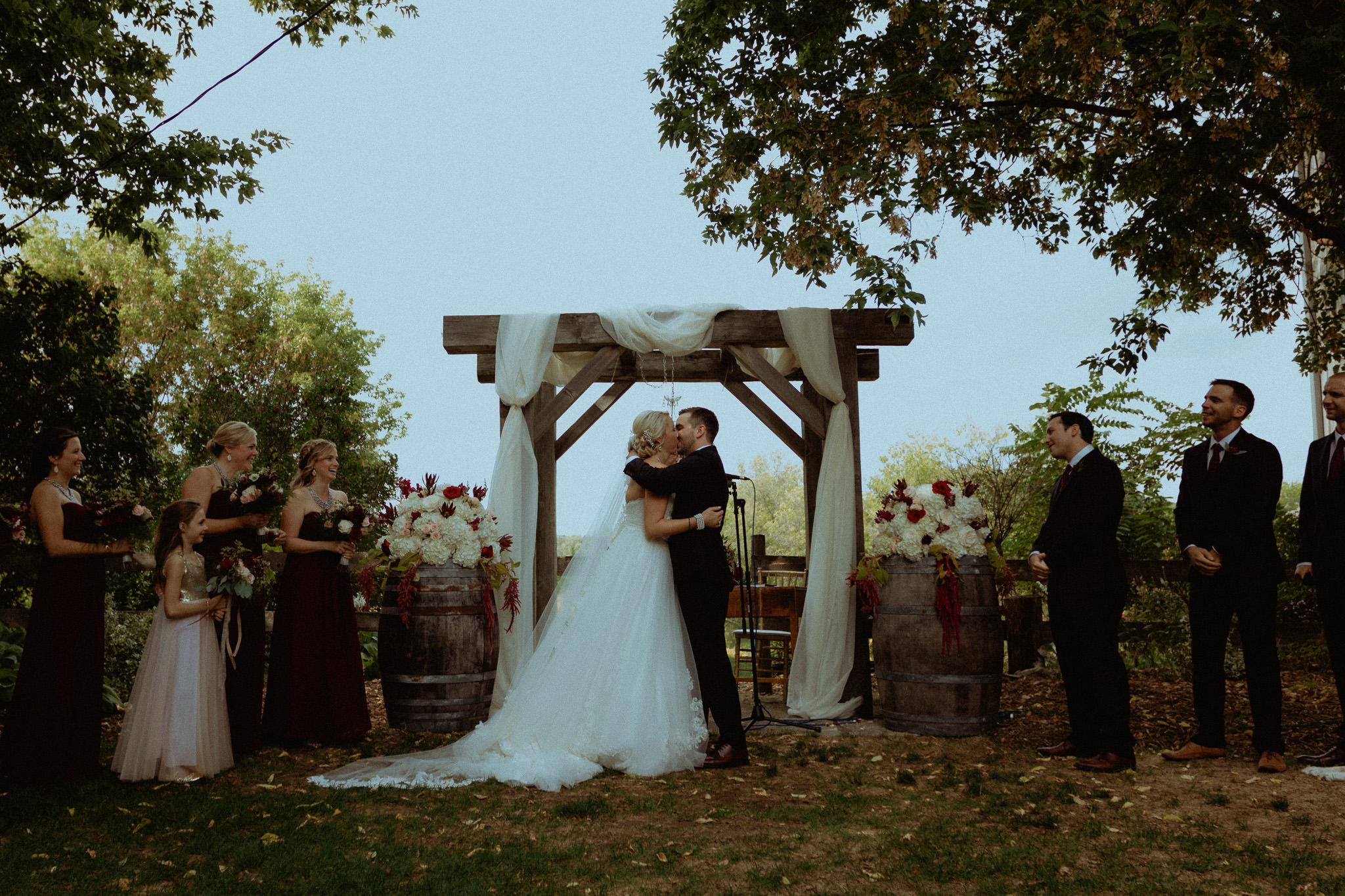 first kiss outdoor rustic wedding ceremony