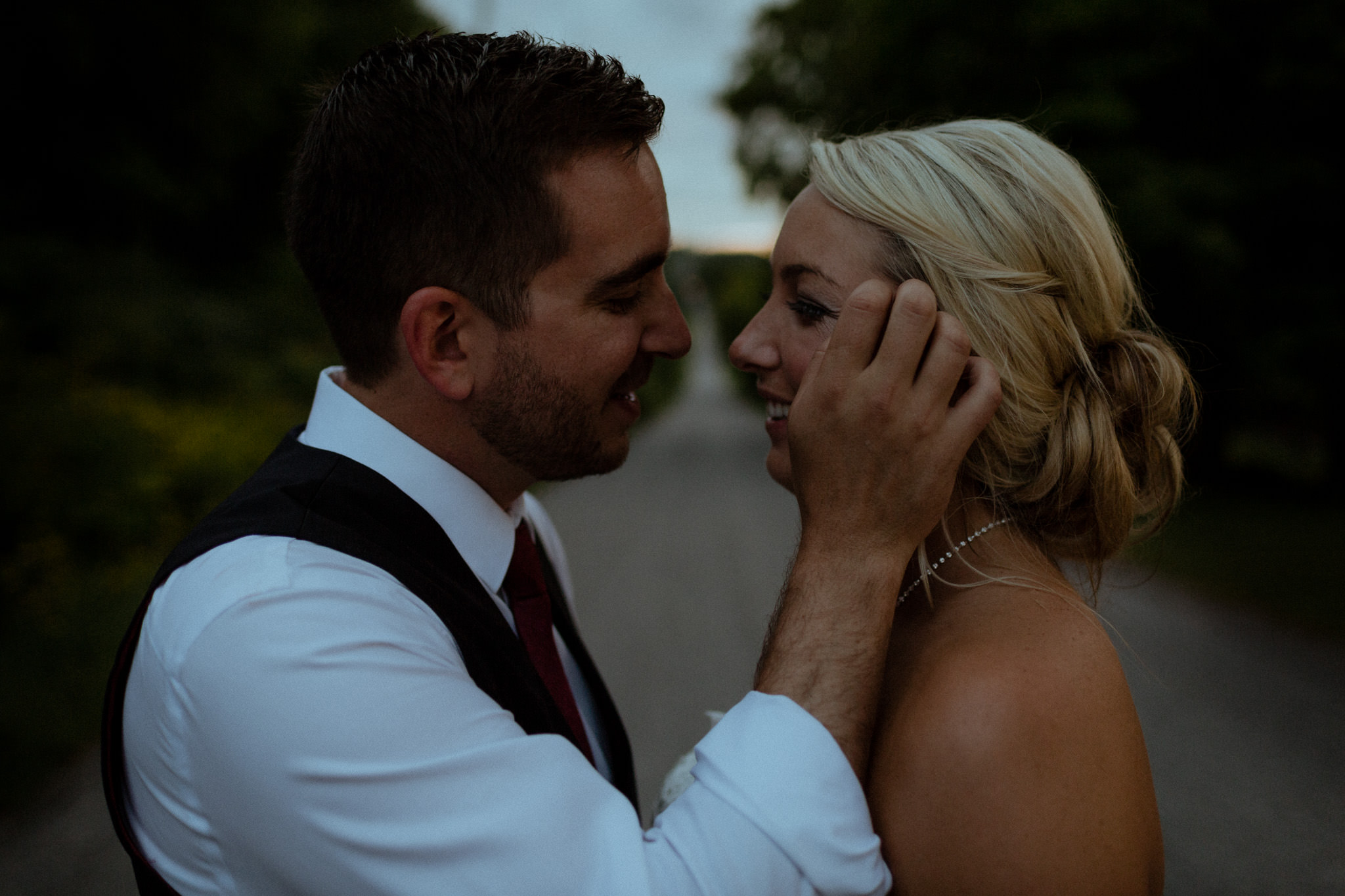 couple kissing on street peterborough wedding photographer
