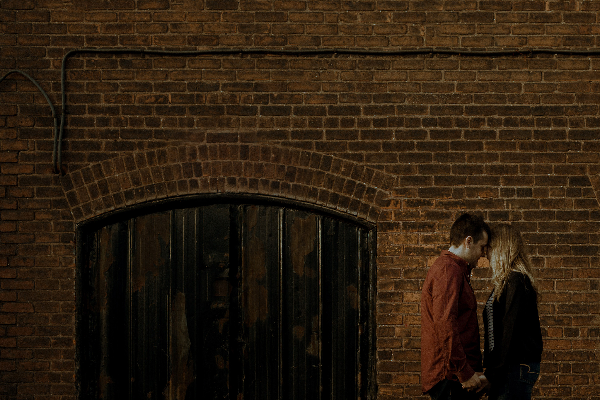 vintage couple framed by industrial surroundings
