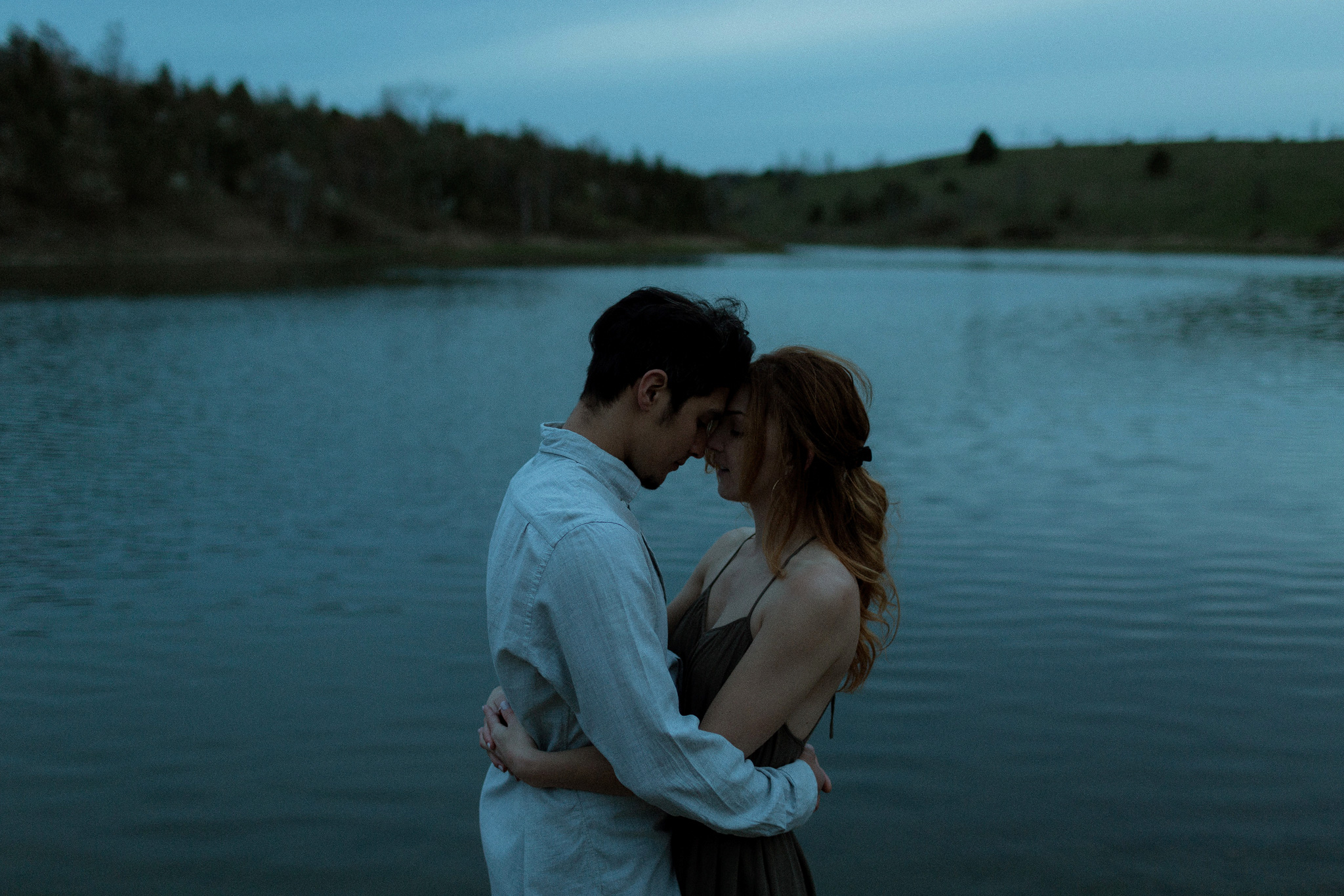 intimate peaceful couple by kettle lake in ontario