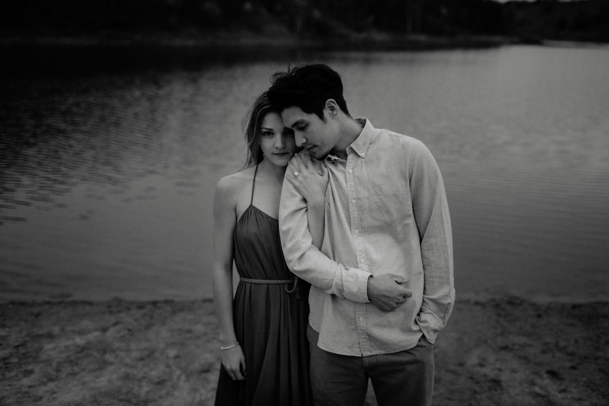 black and white couple by the water