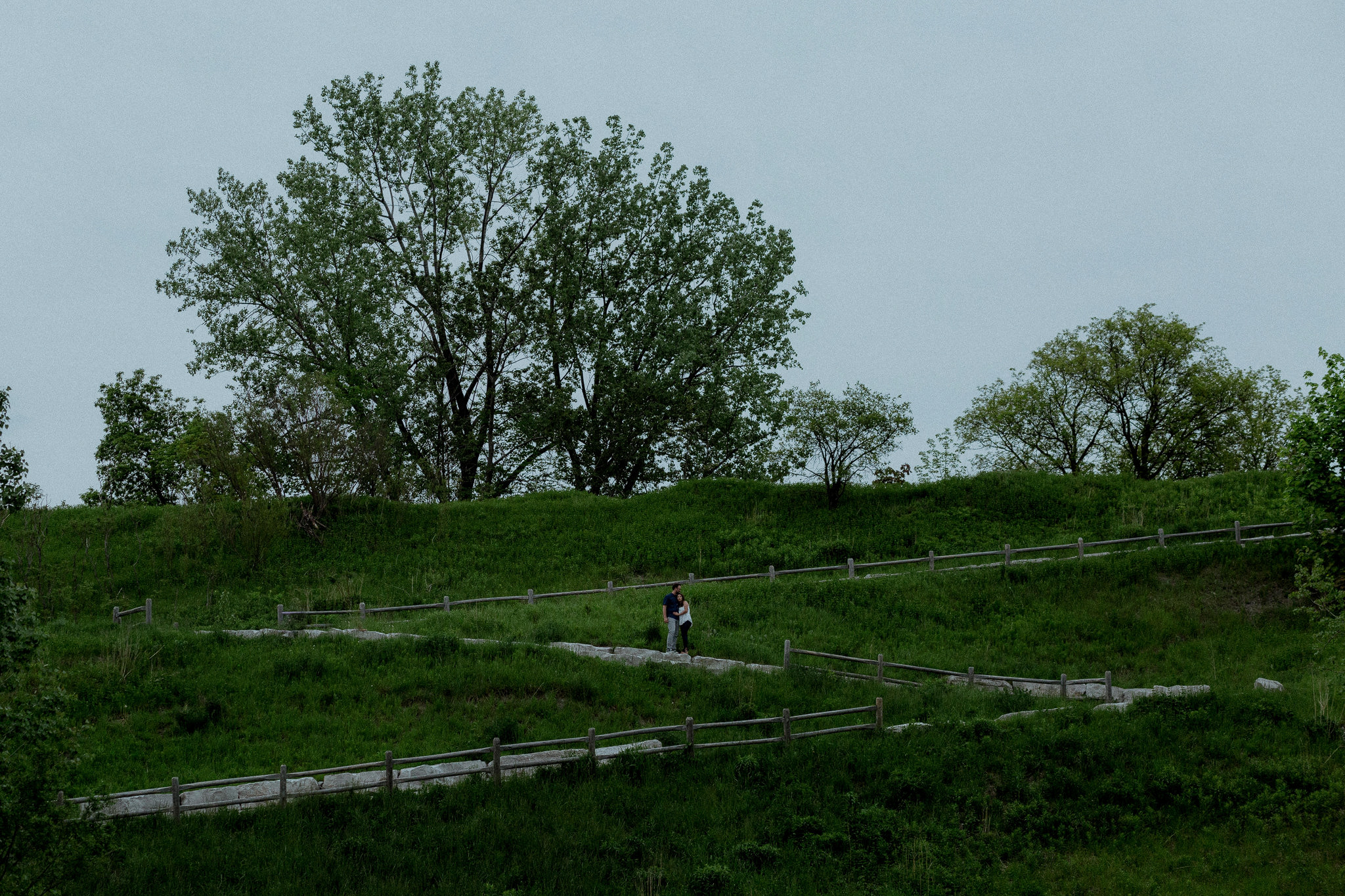 Longshot of couple standing on nature trails outside Toronto
